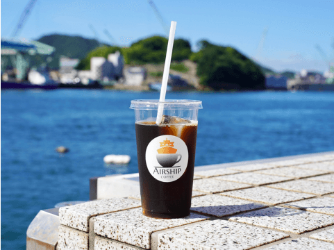 写真:大和湯ゆーゆーの入口。青色ののれんに「ゆ」と書いてます